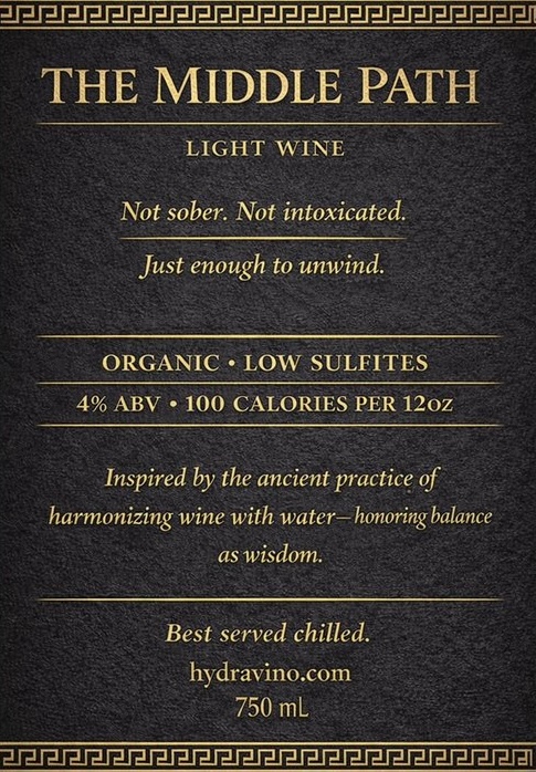 HydraVino back label reading 'The Middle Path' in gold on a dark background, with the full brand story and tasting notes.